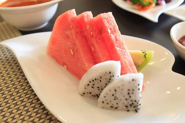 watermelon salad in a plate on a white background