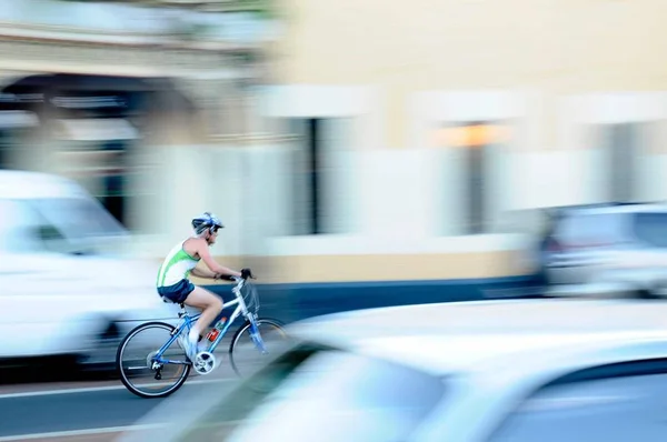 cyclist riding a bike in the city