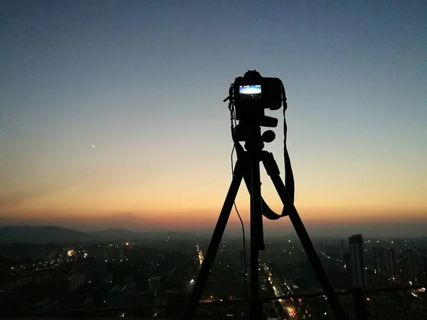silhouette of the city with the camera on the background of the sky