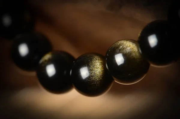 black and white spheres on a dark background