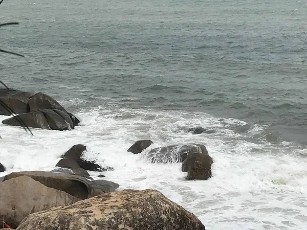 stock image sea waves and rocks on the coast of the mediterranean season