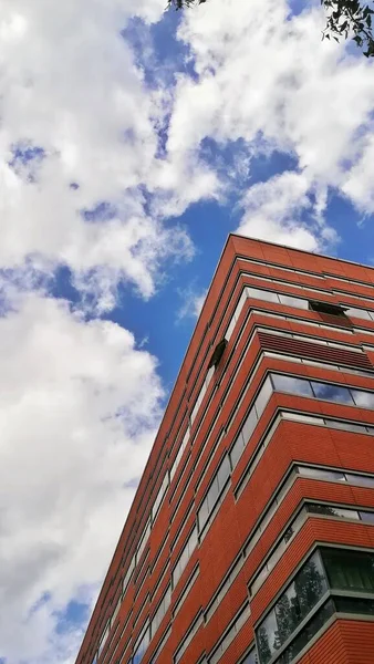 modern building with sky and clouds