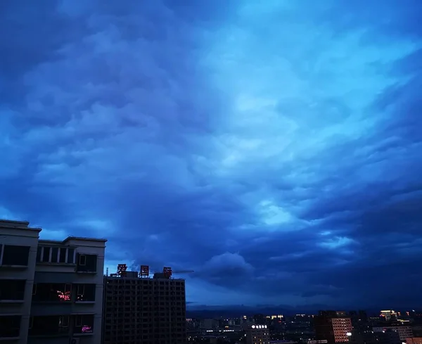 night sky with clouds in the city