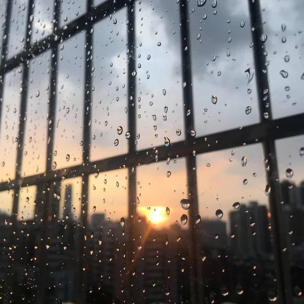 glass window with rain drops, weather