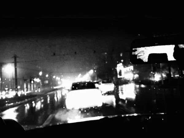 night city with cars and fog