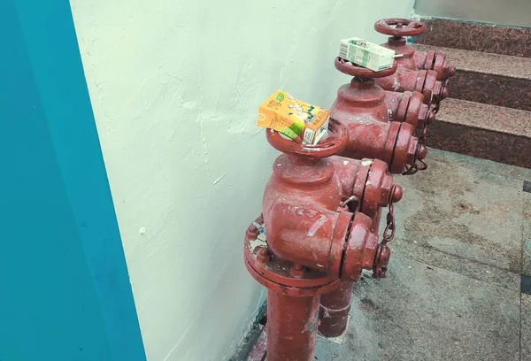 old rusty pipe with water drop on the wall