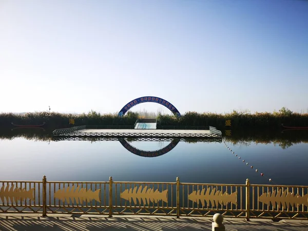 beautiful landscape with a lake and a bridge