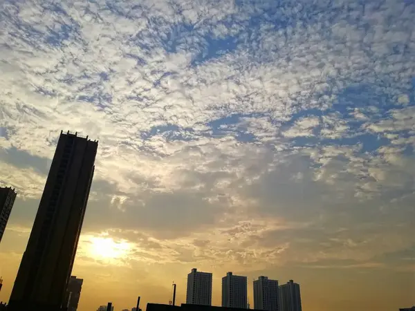 stock image silhouette of a city with a sunset