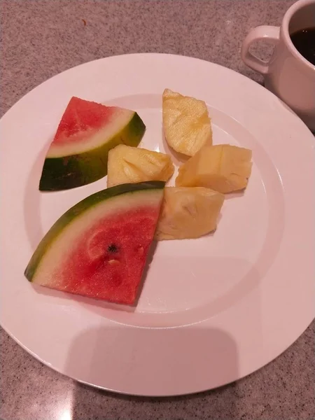 stock image sliced watermelon and slices of fresh fruit on white plate