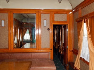 Interior room of a railway car in a train