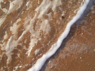 Sea beach on the Kerch peninsula of Crimea on the Azov water and sand texture