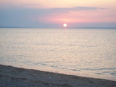 Sea beach on the Kerch peninsula of Crimea on Azov at sunset