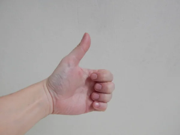Mão sobre fundo branco mostrando sinais — Fotografia de Stock