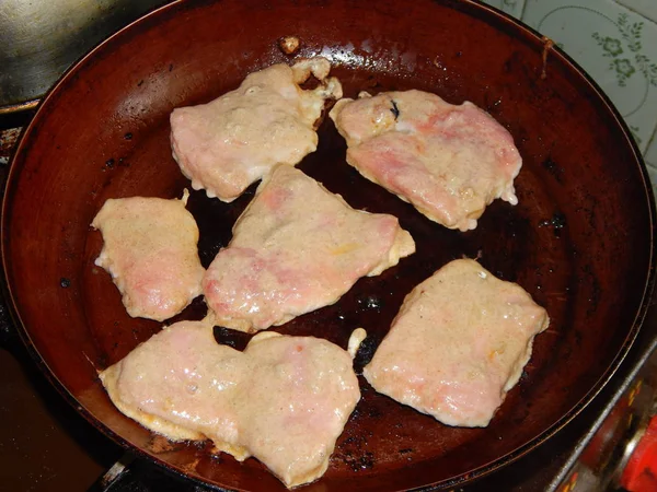 Pork meat rolls with breading fried in a pan — Stock Photo, Image