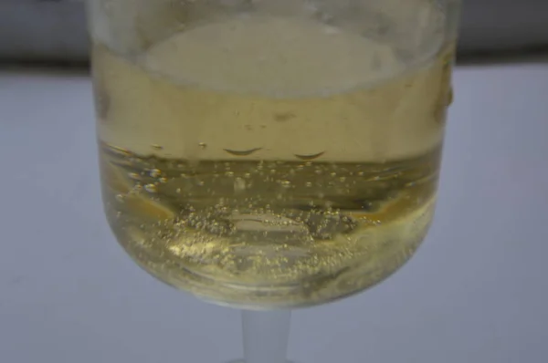 Champagne in a glass on the birthday on a white background — Stock Photo, Image