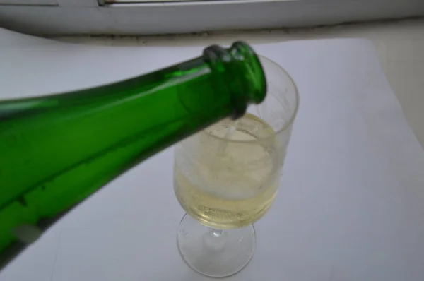 Champagne in a glass on the birthday on a white background — Stock Photo, Image