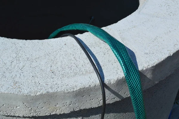 Installing a vibration pump in a water well — Stock Photo, Image