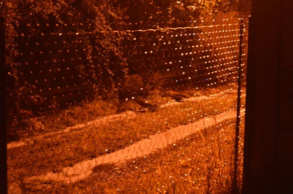 Night netting lighting a lantern — Stock Photo, Image