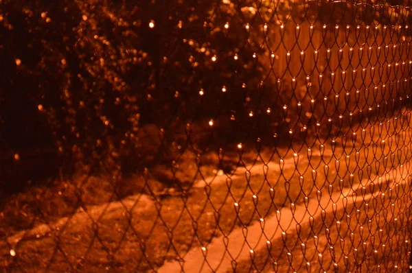 Night netting lighting a lantern — Stock Photo, Image