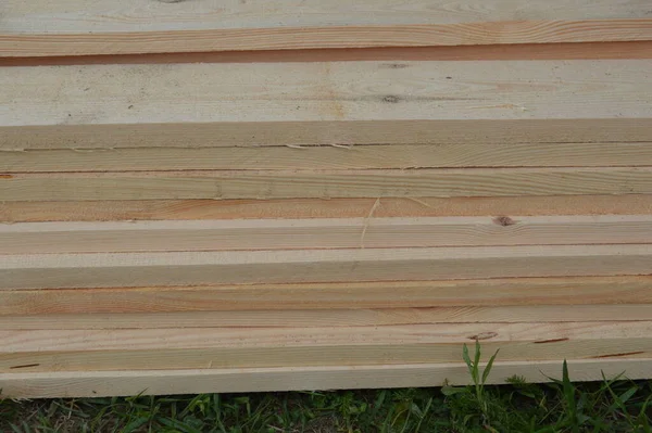 Lumber boards and pine bars for the construction