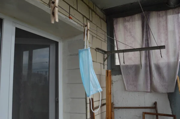 The mask from the virus hangs and dries after washing on  balcony