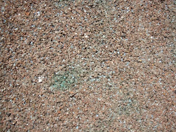 Granitkrümel in der Wand. Granitstein, Mauer aus Granit. — Stockfoto