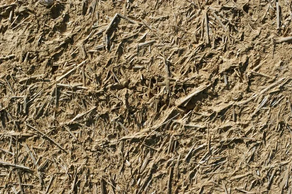 Old wall of a combination of red clay and straw — Zdjęcie stockowe