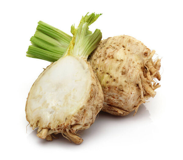 Fresh celery stalks and celeriac isolated on white background. Studio shot.