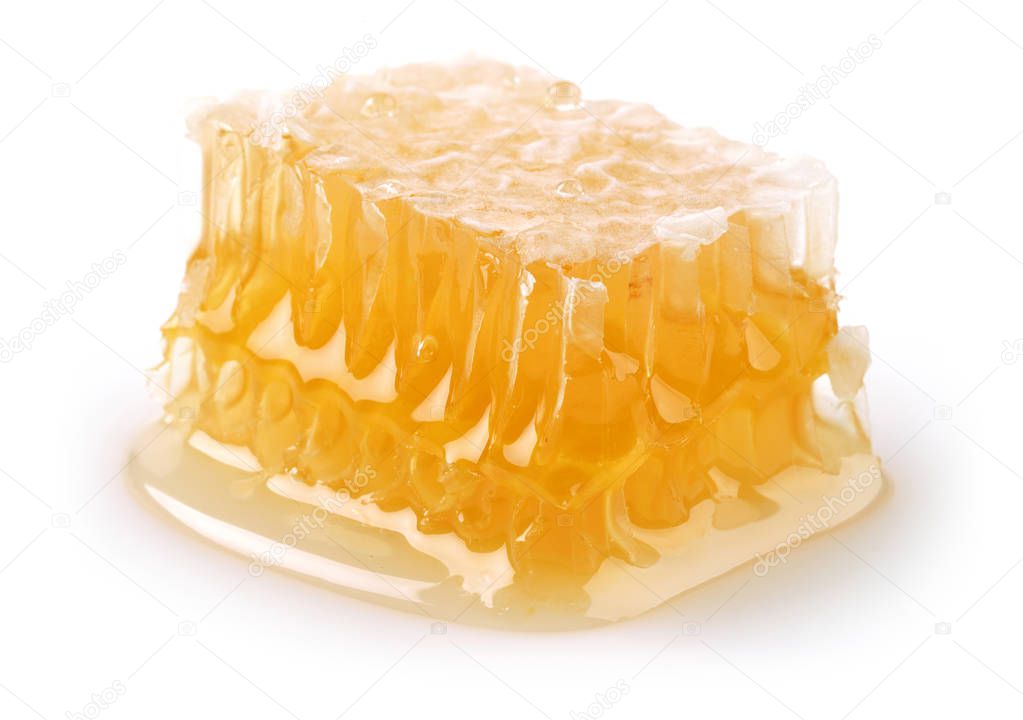 Honey with honeycomb isolated on white background