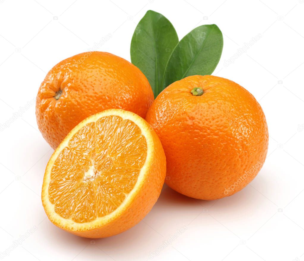 Fresh Oranges and leaves isolated on white background