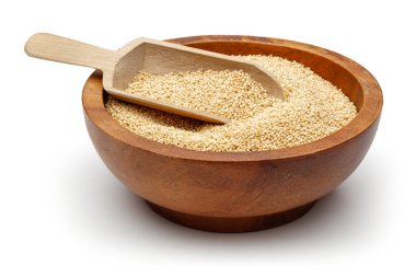 Amaranth grains in wooden bowl with spoon isolated on white background