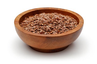 ahşap kase beyaz zemin üzerine izole keten tohumu