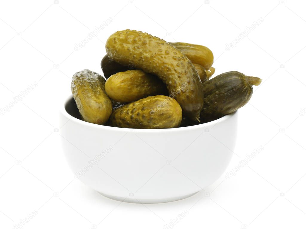 Pickled cucumbers in a bowl isolated on white background