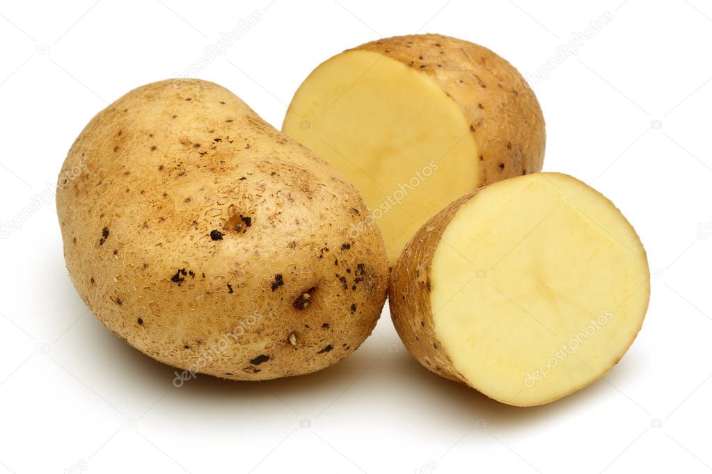 Fresh potatoes with slices isolated on white background