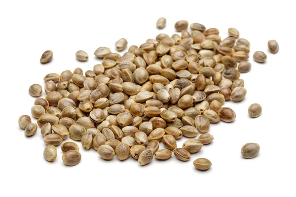 Heap of dry hemp seeds isolated on white — Stock Photo, Image