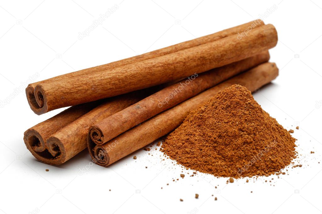 Cinnamon sticks and powder isolated on white