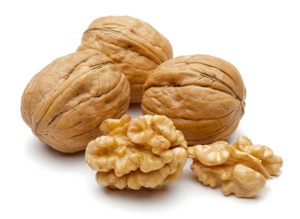 Whole and cracked walnuts isolated on white — Stock Photo, Image