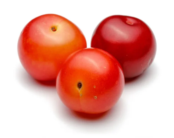 Group of red plums isolated on white — Stock Photo, Image