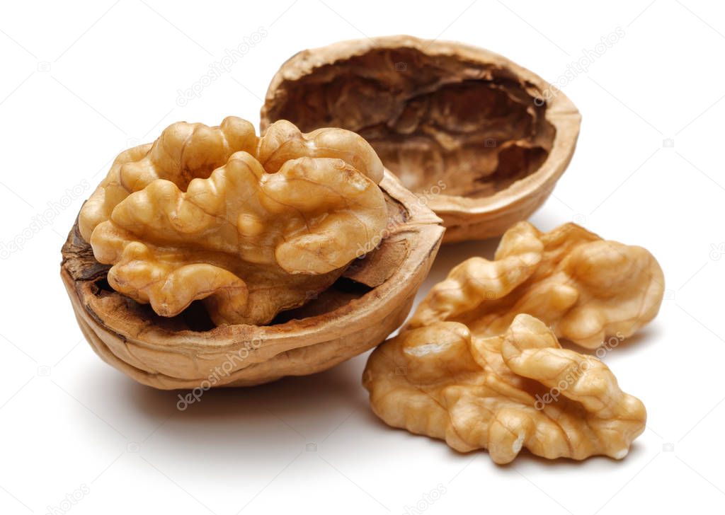 Broken walnuts isolated on white