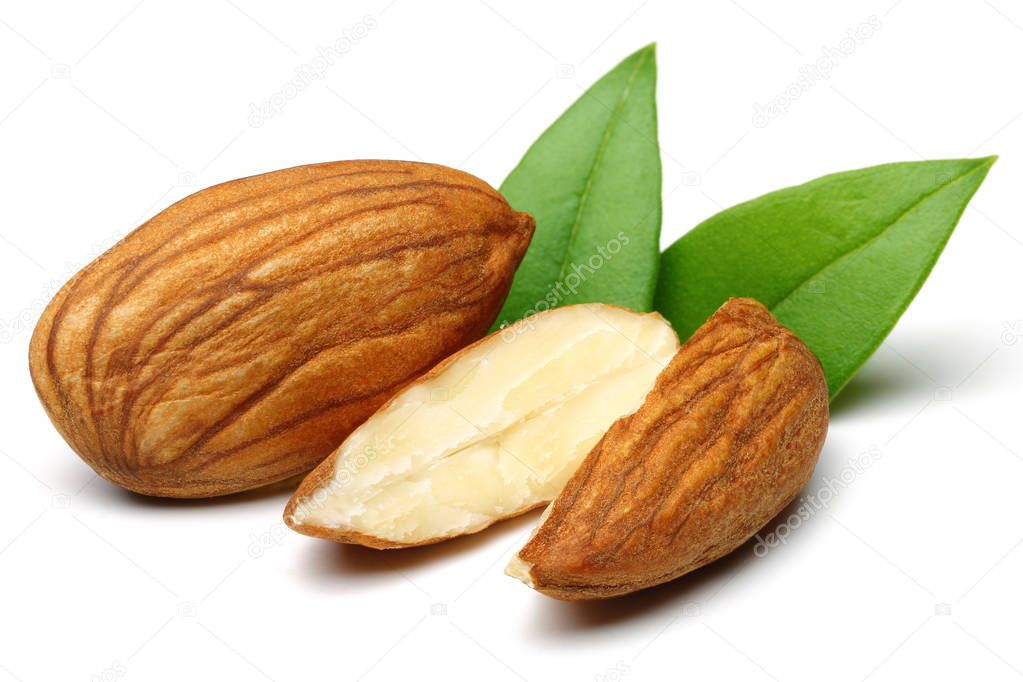 Group of almonds with leaves isolated on white
