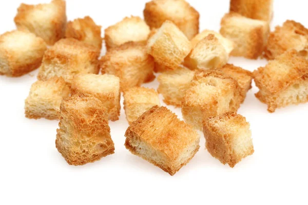 Tiny bread cubes, croutons isolated on white — Stock Photo, Image