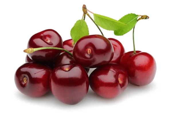 Ripe red cherries with green leaves isolated — Stock Photo, Image