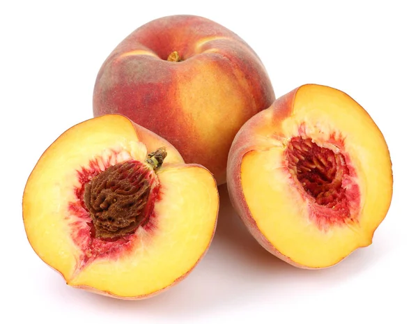 Whole and half peach fruits isolated Stock Photo