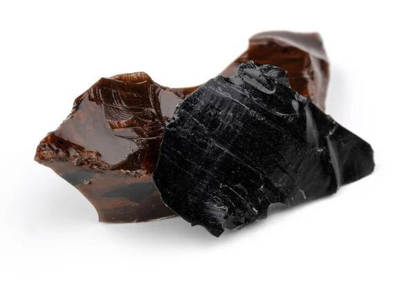 Bruine en Zwarte Obsidiaan stukken geïsoleerd — Stockfoto