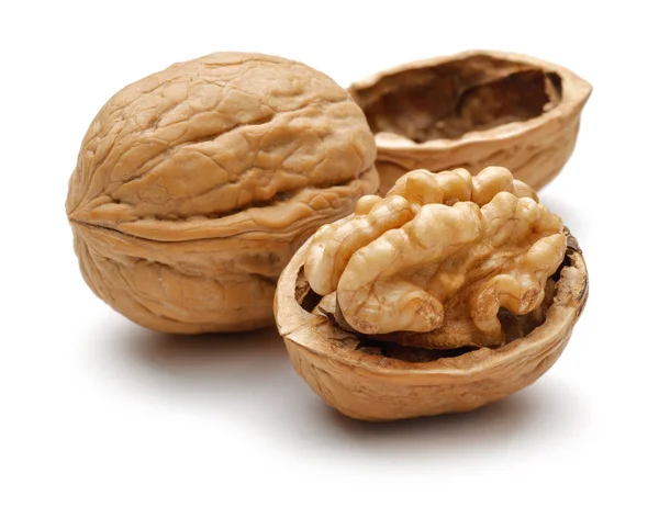 Whole and cracked walnuts isolated on white — Stock Photo, Image