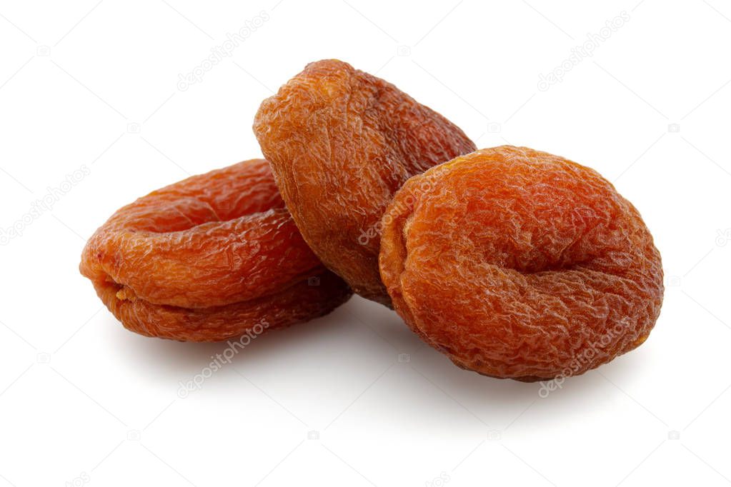 Organic dried apricots isolated on white