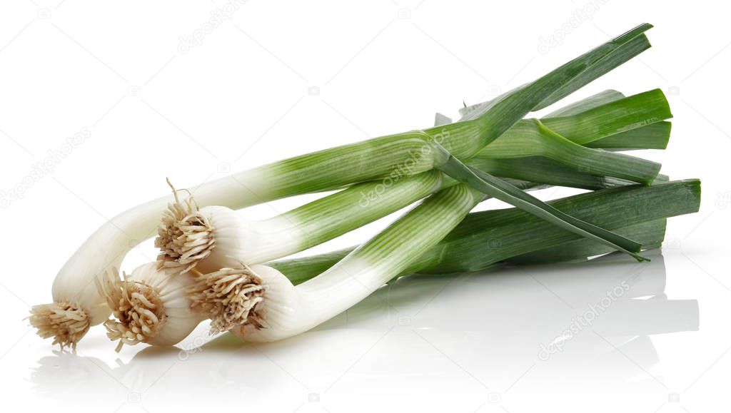 Fresh green garlic isolated on white