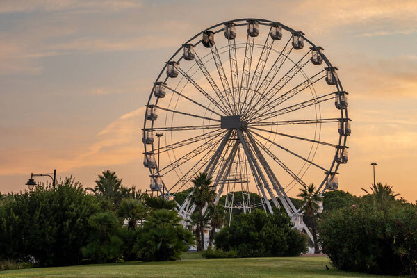 Ferris wheel at the Park Giardinetti at sunrise, Olbia, Sardinia, Italy