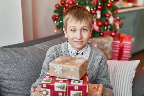 boy with gifts in the New Year\'s interior