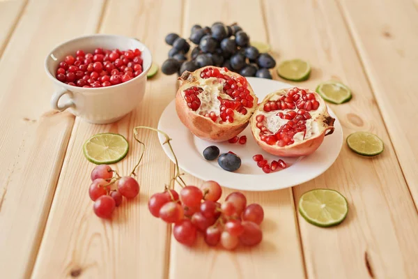 Pomegranate Grapes Lime Cranberries Wooden Surface — Stock Photo, Image